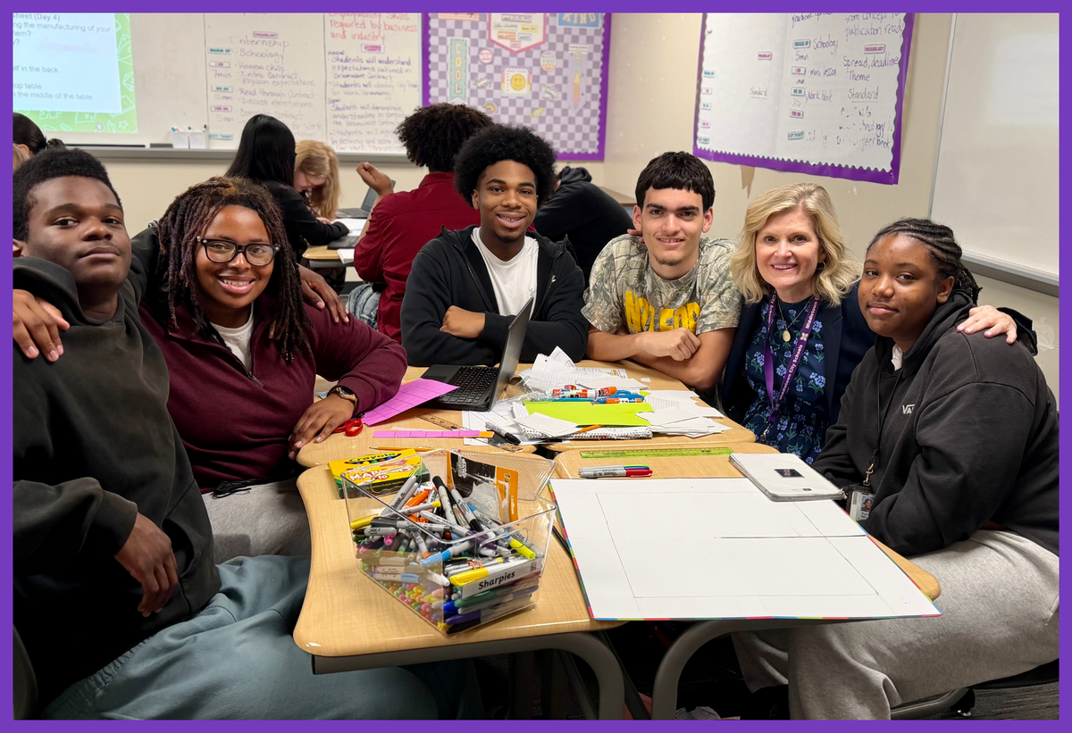 photo of superintendent with a group of students
